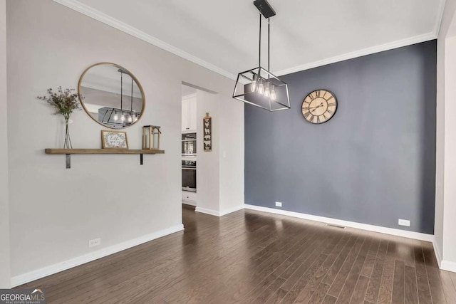 unfurnished dining area with crown molding and dark hardwood / wood-style floors