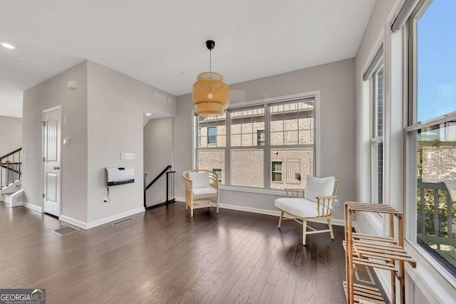 living area with dark wood-type flooring