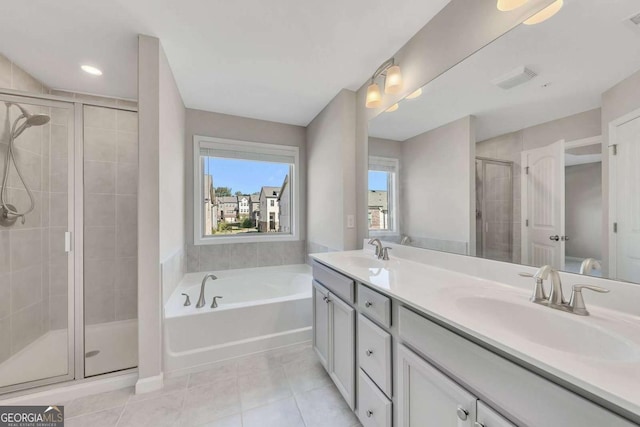 bathroom with vanity, tile patterned floors, and independent shower and bath