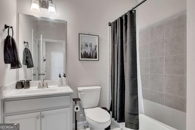 full bathroom featuring vanity, shower / tub combo, and toilet