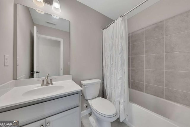 full bathroom with vanity, toilet, and shower / tub combo