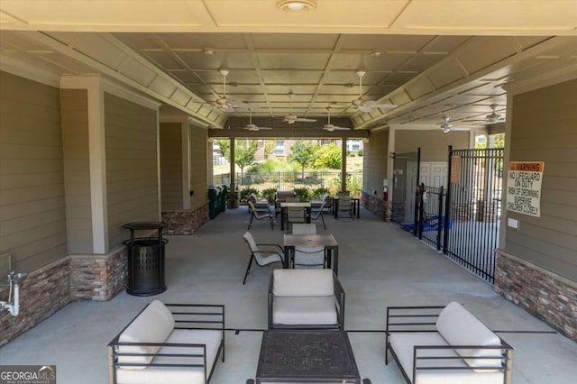 view of patio featuring ceiling fan