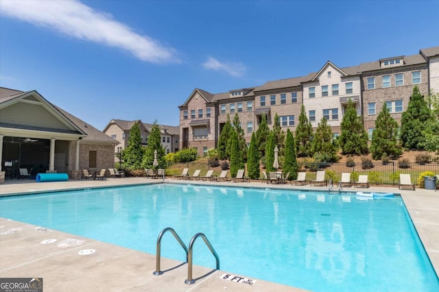 view of swimming pool featuring a patio area