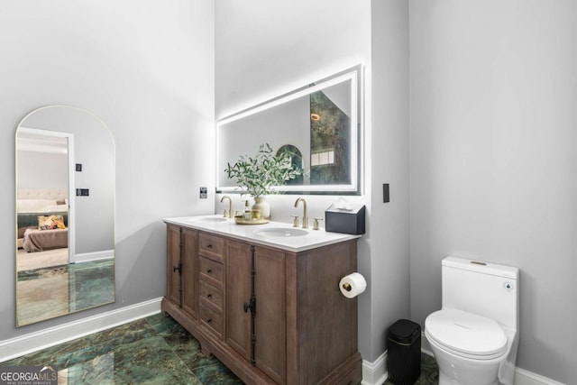 bathroom with vanity and toilet