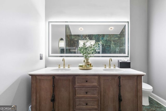 bathroom with vanity and toilet