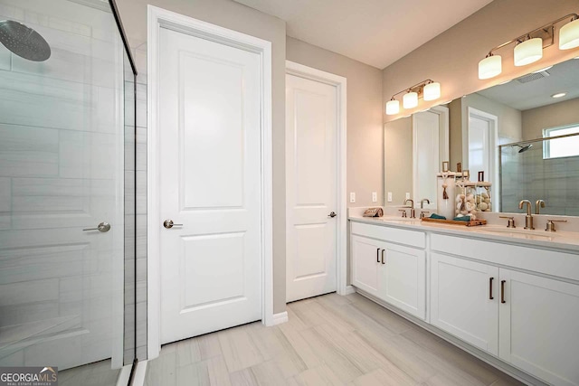 bathroom with vanity and an enclosed shower