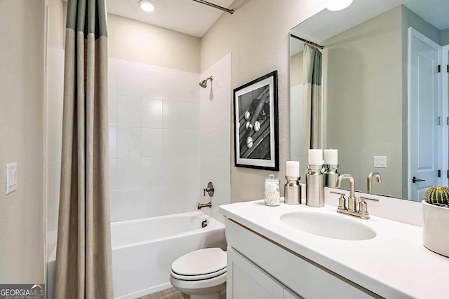 full bathroom featuring vanity, toilet, and shower / tub combo