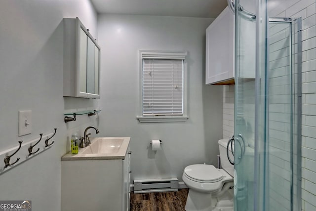 bathroom featuring vanity, wood-type flooring, a baseboard radiator, toilet, and walk in shower