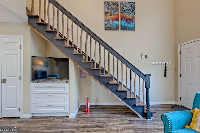 stairs featuring wood-type flooring