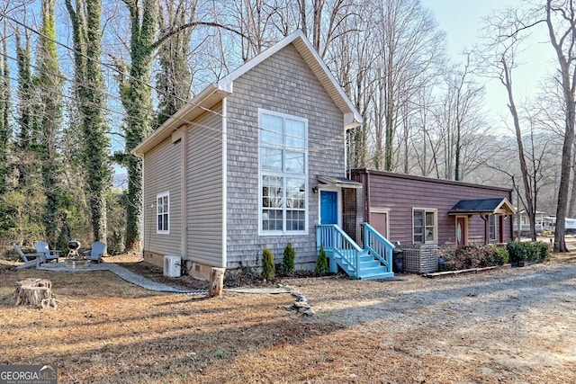 view of front property featuring an outdoor fire pit