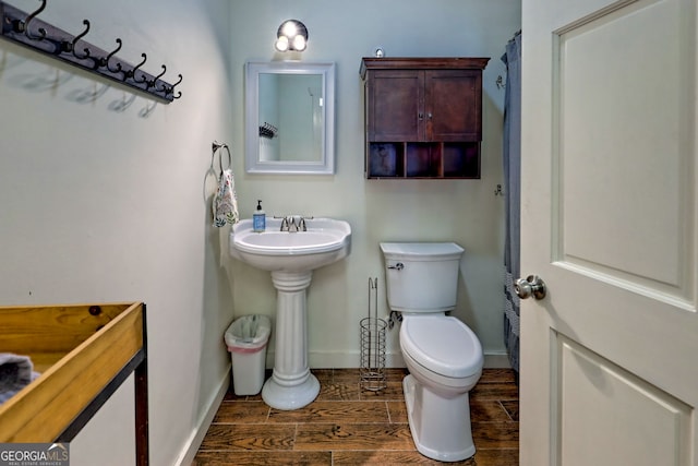 bathroom featuring sink and toilet