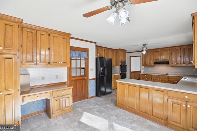 kitchen with sink, built in desk, ornamental molding, ceiling fan, and black appliances