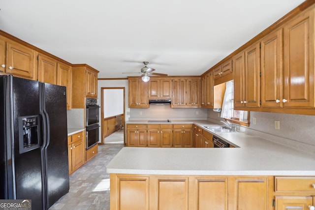 kitchen with sink, kitchen peninsula, ceiling fan, and black appliances