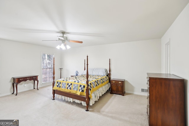 bedroom featuring light carpet and ceiling fan