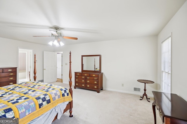 bedroom featuring light colored carpet and ceiling fan