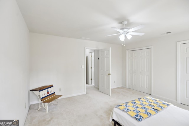 unfurnished bedroom featuring ceiling fan and light carpet