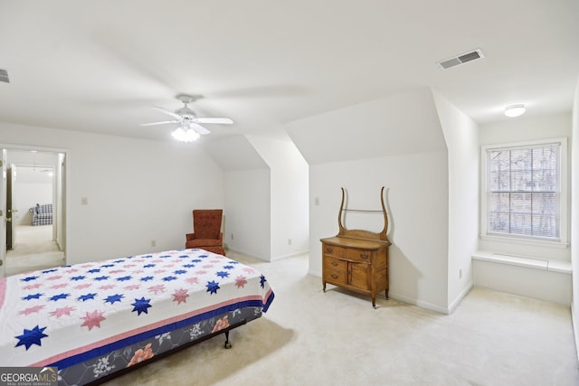 carpeted bedroom featuring vaulted ceiling and ceiling fan