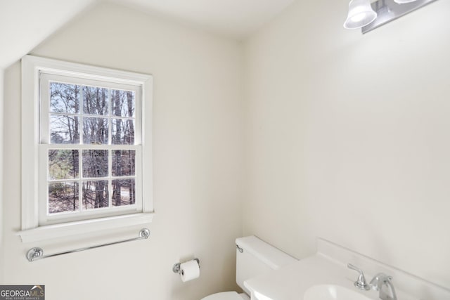 bathroom featuring toilet and sink