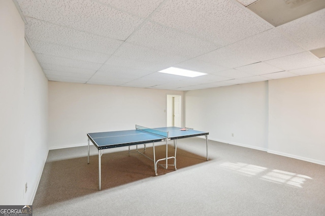 playroom featuring carpet flooring and a drop ceiling