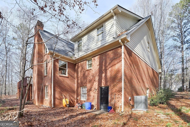 rear view of property featuring cooling unit