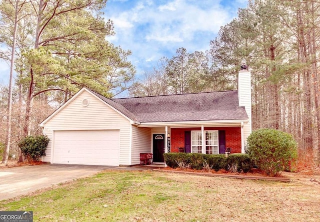 view of front of home with a garage and a front yard