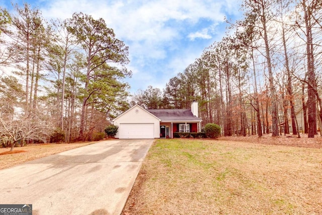 view of front of property featuring a garage and a front yard