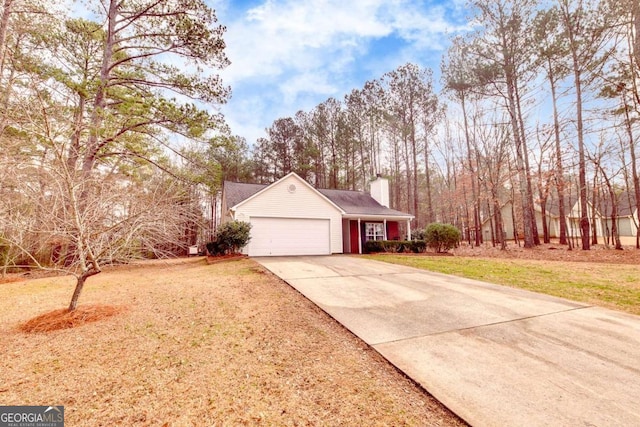 view of property exterior with a garage and a yard