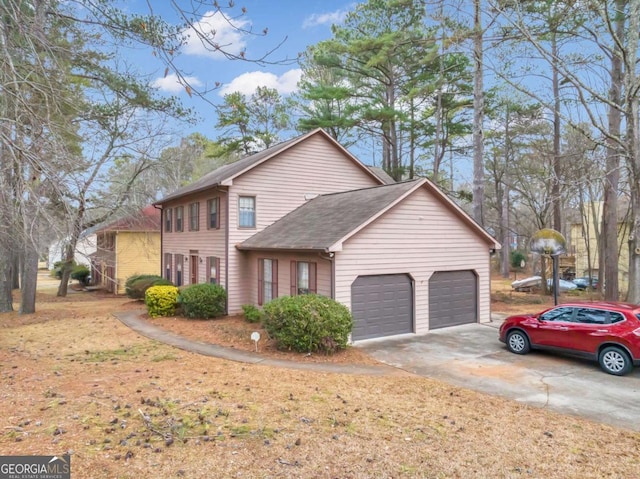 view of front of property with a garage