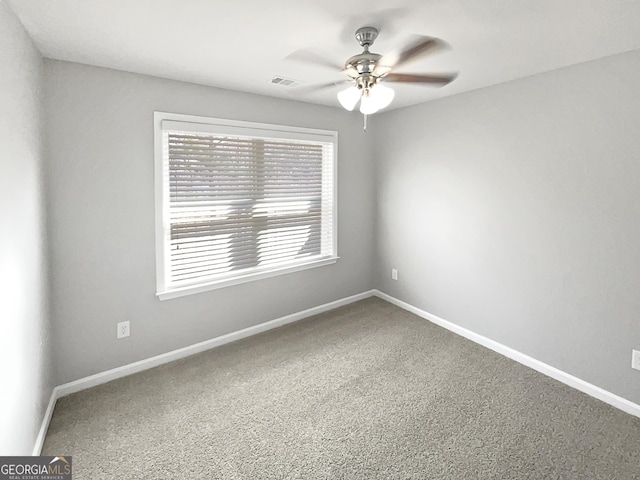 unfurnished room with ceiling fan