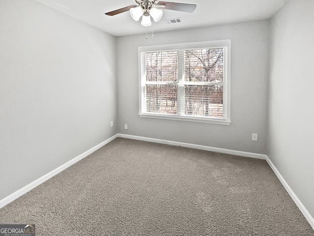 carpeted empty room with ceiling fan