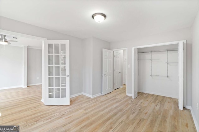 unfurnished bedroom featuring a closet and light hardwood / wood-style flooring