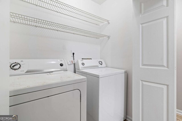 walk in closet featuring hardwood / wood-style flooring