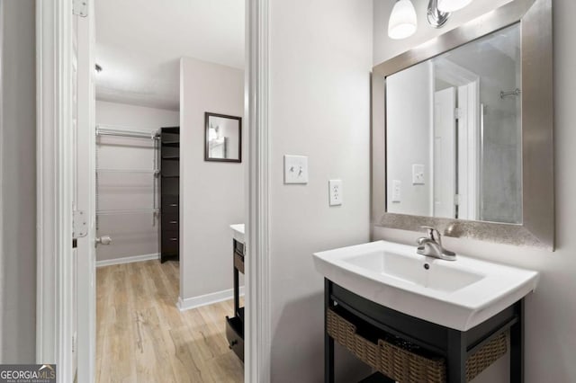 bathroom featuring vanity and hardwood / wood-style flooring