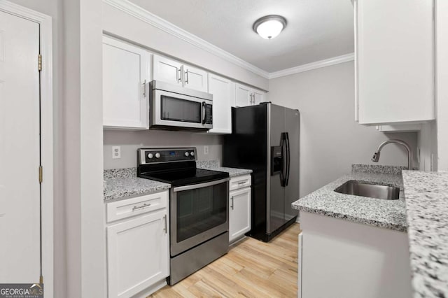 kitchen with sink, white cabinetry, crown molding, stainless steel appliances, and light stone countertops