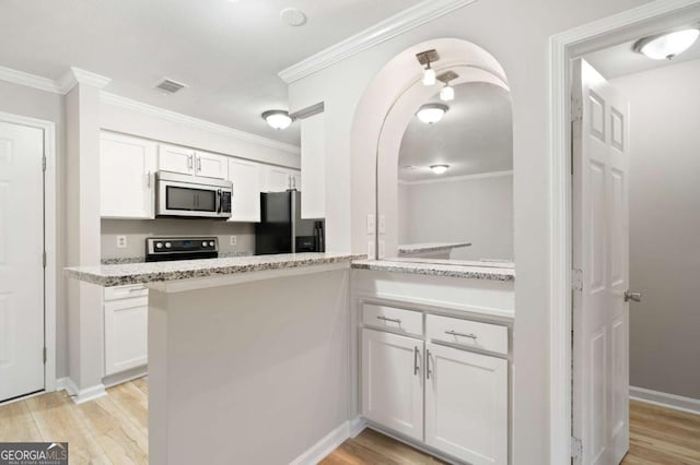 kitchen with white cabinetry, appliances with stainless steel finishes, crown molding, and light hardwood / wood-style flooring