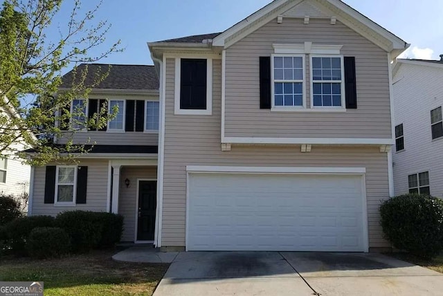 view of front of property featuring a garage