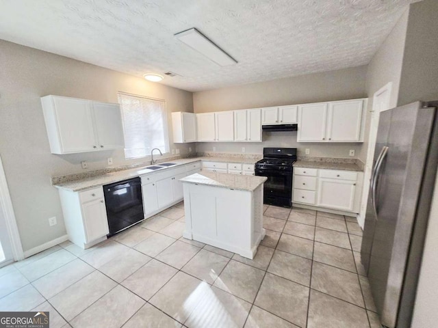 kitchen featuring sink, white cabinets, a center island, light tile patterned floors, and black appliances