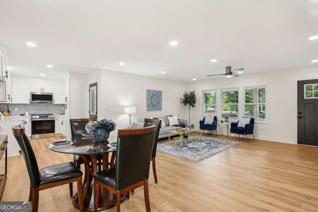 dining space featuring light wood-type flooring