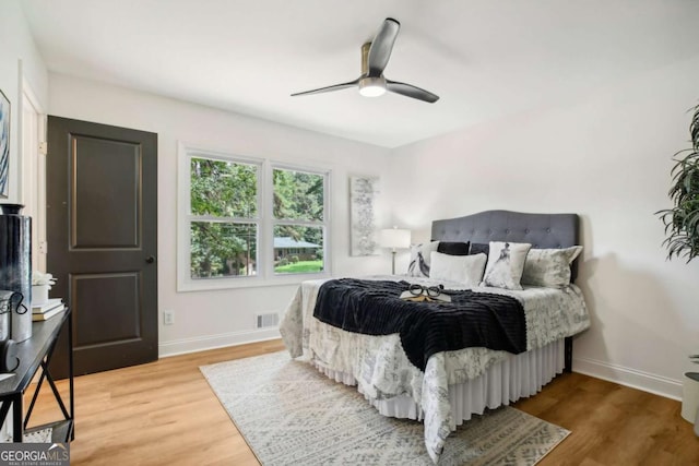 bedroom featuring hardwood / wood-style floors and ceiling fan