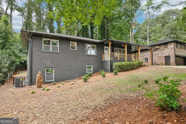 view of front of house featuring central AC unit and a garage