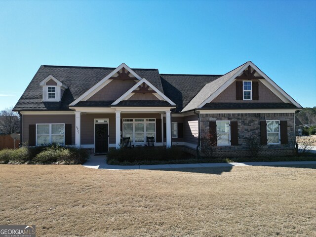 craftsman-style house with a front lawn