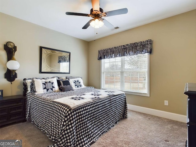 carpeted bedroom with ceiling fan