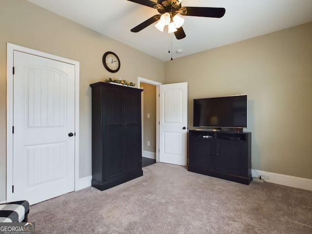 unfurnished bedroom featuring ceiling fan and light carpet