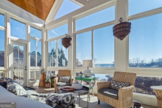 sunroom featuring vaulted ceiling and wooden ceiling