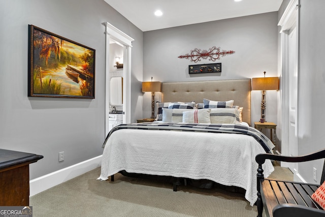 carpeted bedroom with ensuite bathroom