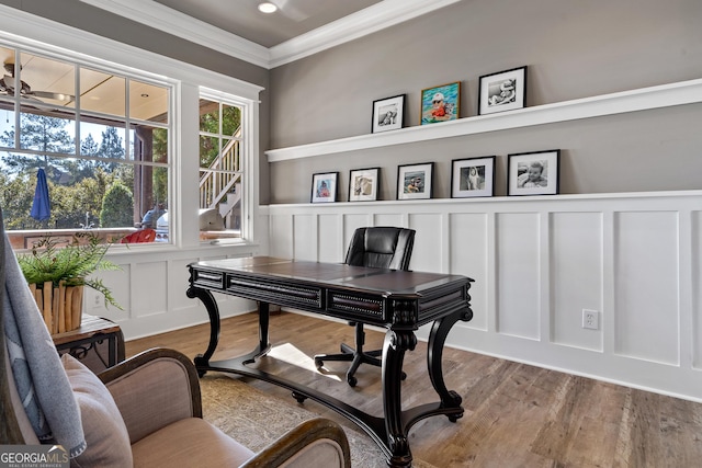 office featuring hardwood / wood-style floors, crown molding, and ceiling fan