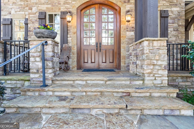 property entrance featuring french doors