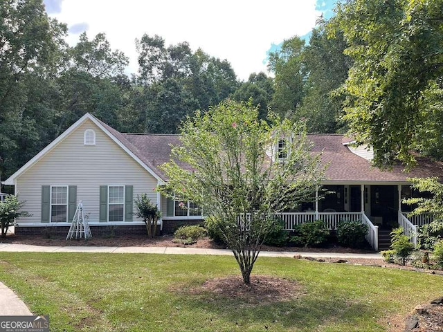 view of front of home with a porch and a front lawn