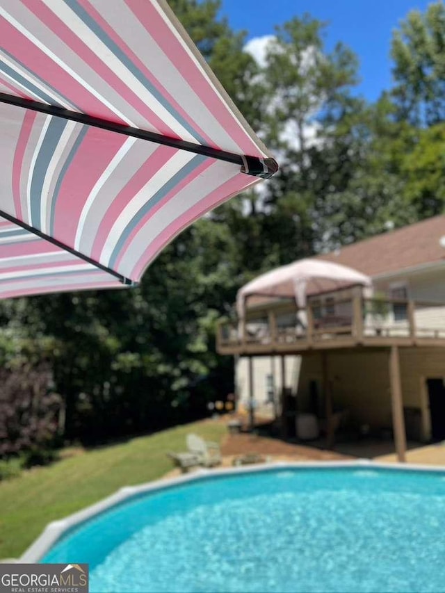 view of pool featuring a wooden deck