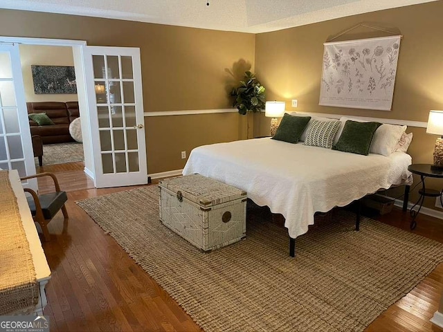 bedroom with hardwood / wood-style floors